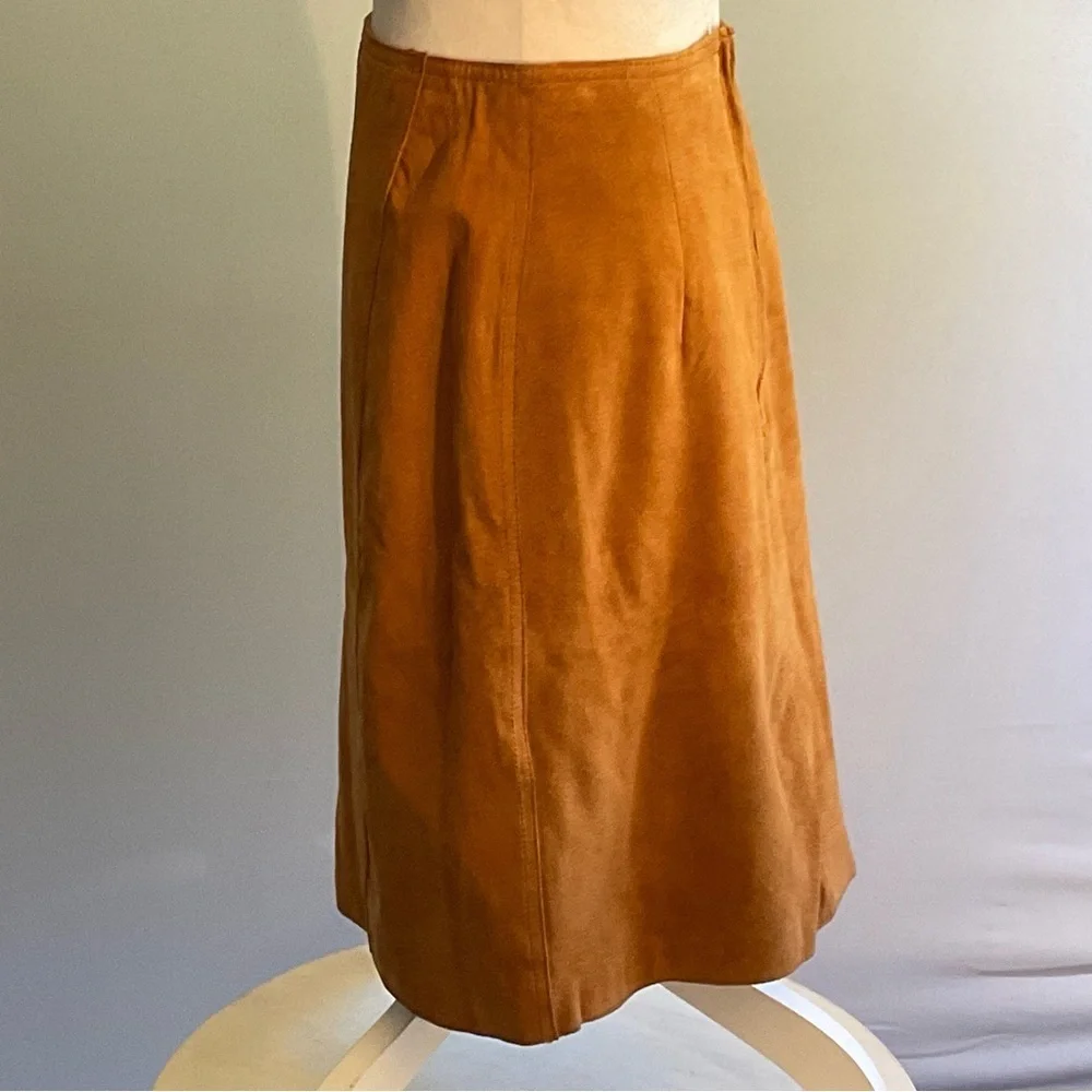 True vintage suede—real leather with clean tailoring an earlier designer era.